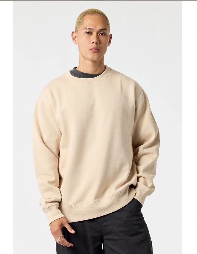 Model wearing a POUND relaxed crewneck sweatshirt