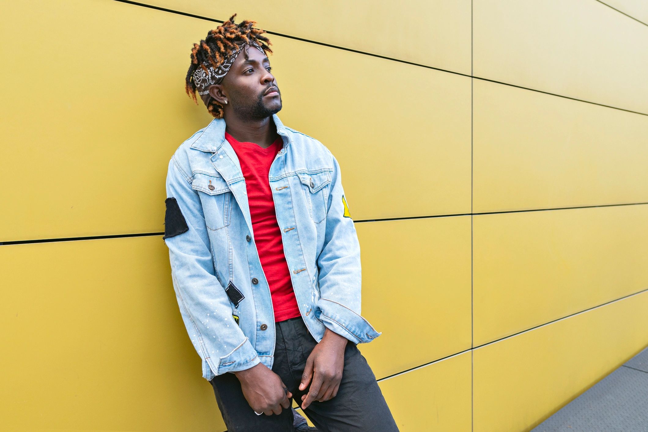 Model wearing a POUND fashion hoodie in an editorial setting